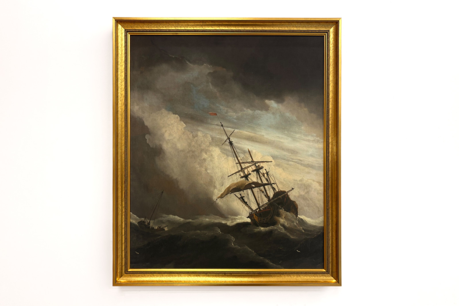 Ett fartyg på öppet hav fångat av en vindby, känt som "Vindstöten" - Willem van de Velde (II)