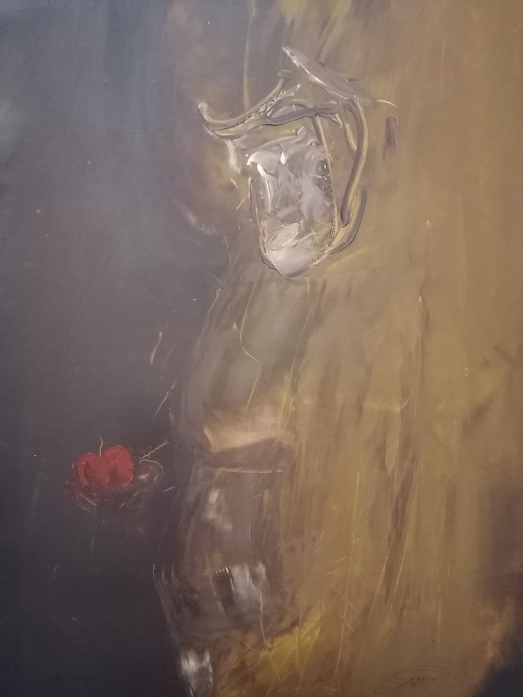 Kontemplativ figur med rött äpple av Stefano Mazzolini