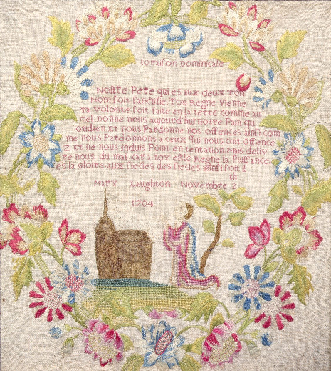 Provtagare med Lords Prayer på franska ovanför en knästående figur, arbetad av Mary Laughton, 1704 (siden) Mary Laughton, 1704 av Unknown