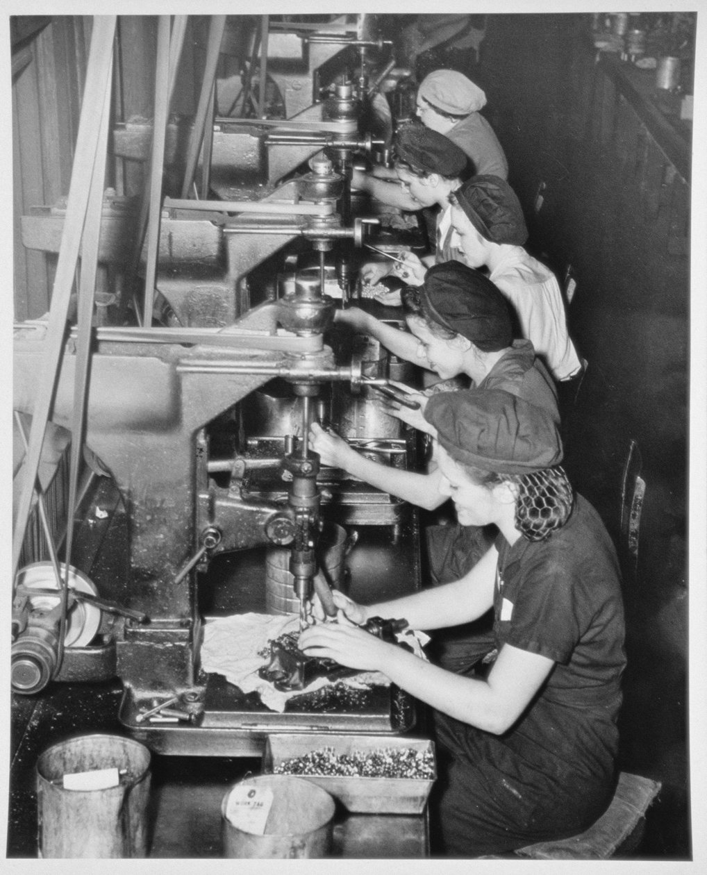 Women assembling aircraft parts inside factories, c.1943  av American Photographer
