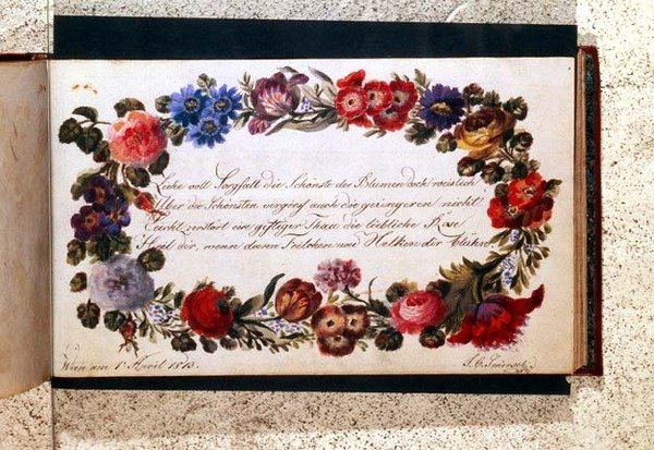 Frontispice av en besöksbok dekorerad med ett epigram på tyska omgiven av en krans av blommor, daterad 1 april 1813 (wc) av Austrian School