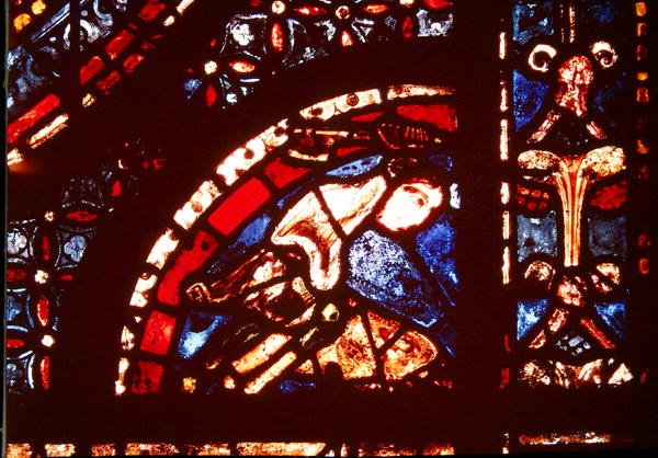 En slaktare, detalj från det nedre högra hörnet av Miracles of the Virgin Window i långhusets södra gång, 1205-15 av French School