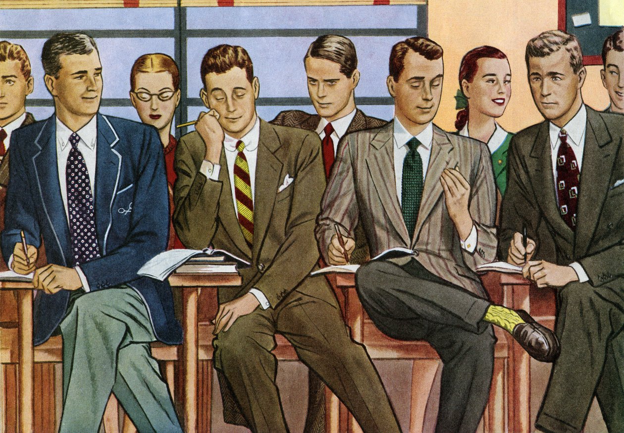 Studenter vid skrivbord sitter i ett klassrum på en skola på 1940-talet av American School