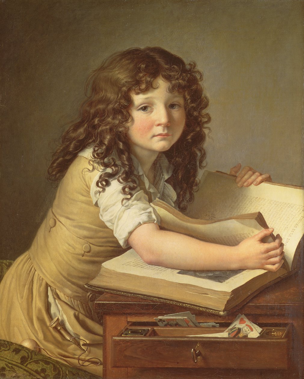 Ett barn som tittar på bilder i en bok av Anne Louis Girodet de Roucy Trioson