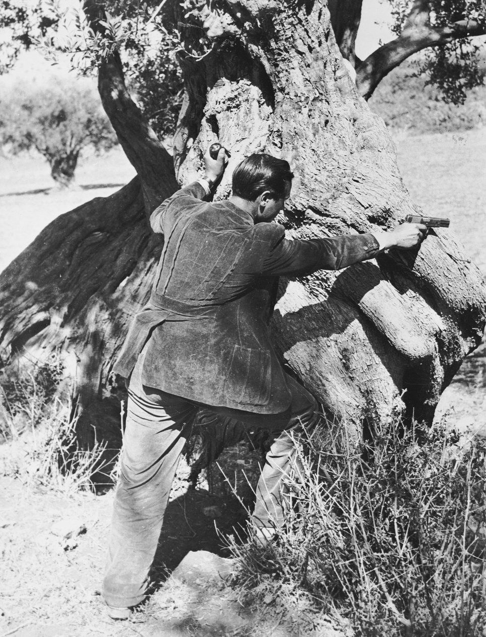 Salvatore Giuliano pekar med en pistol, 1937 av Armando Bruni