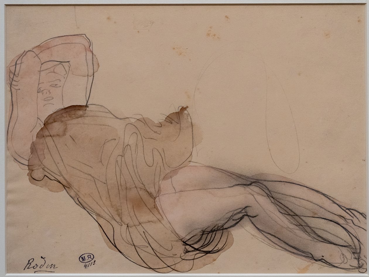Kvinna liggande, halvnaken och med armarna korsade bakom huvudet av Auguste Rodin