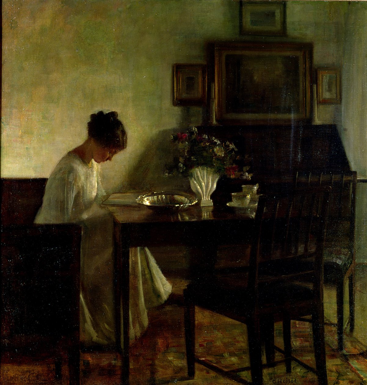 Flicka som läser i en interiör av Carl Holsoe