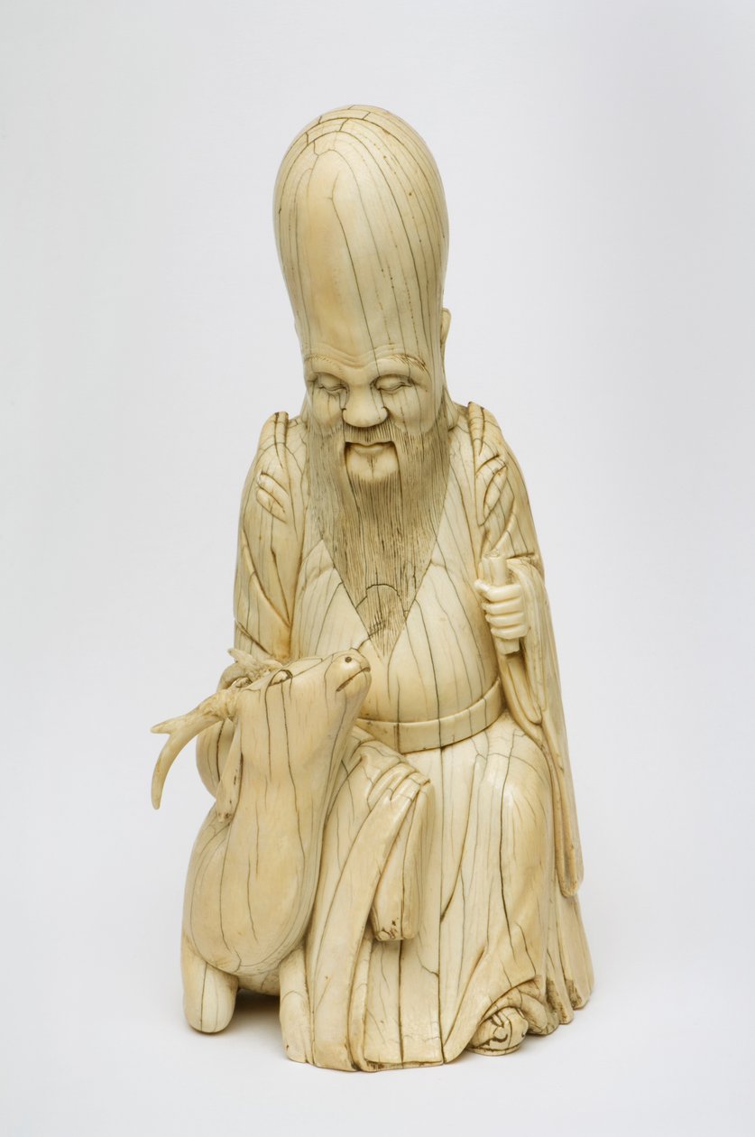 Snidade elfenbensfigur av Shou Xing sittande med rådjur, ca 1580-1644 av Chinese School