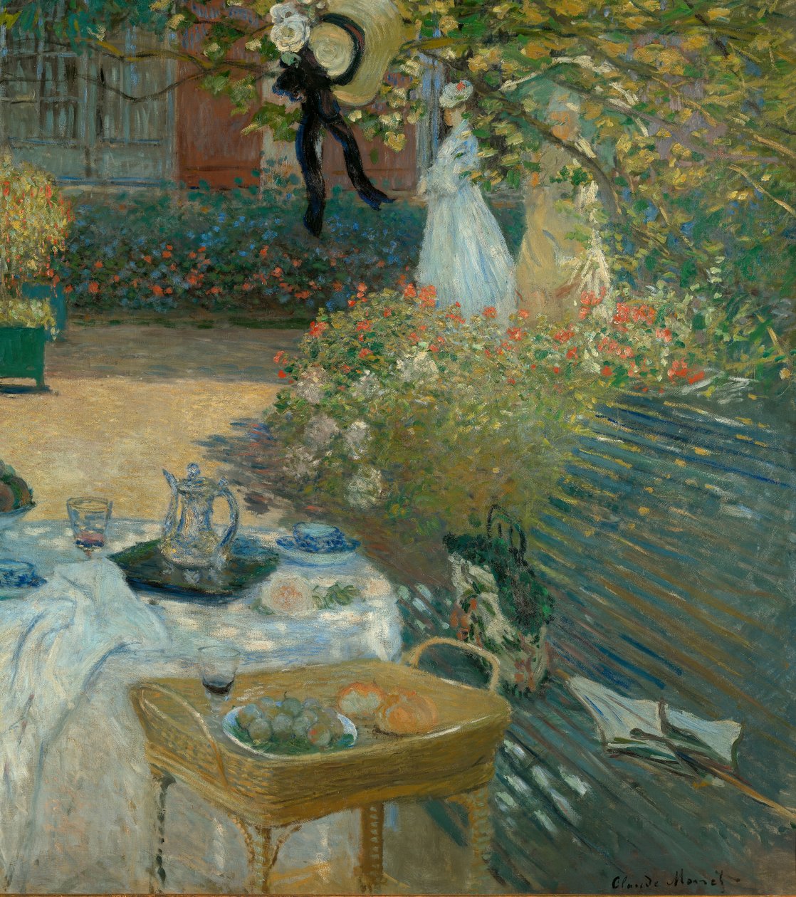 Lunch i Monets trädgård i Argenteuil av Claude Monet