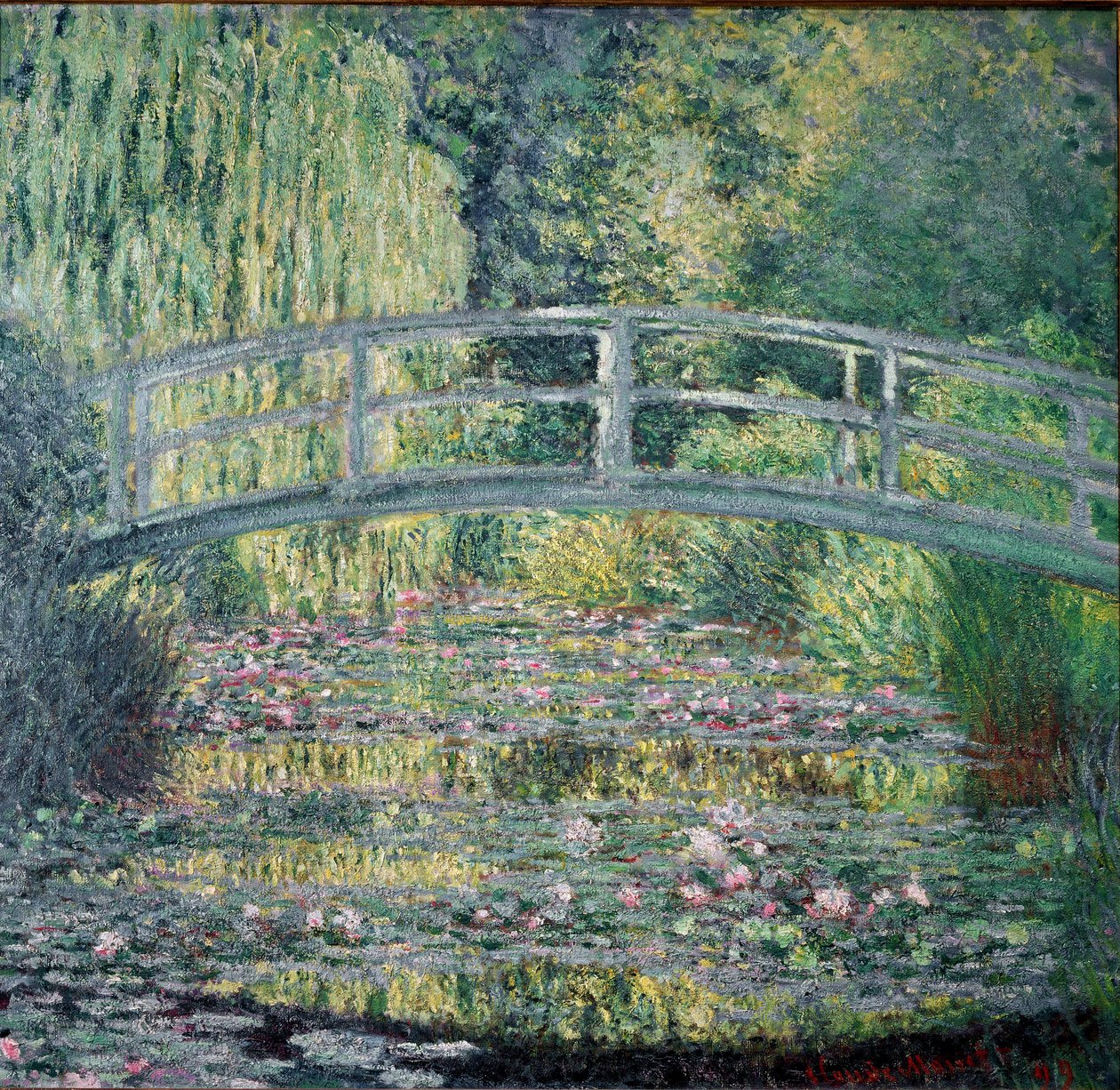 Gångbron och näckrosdammen av Claude Monet
