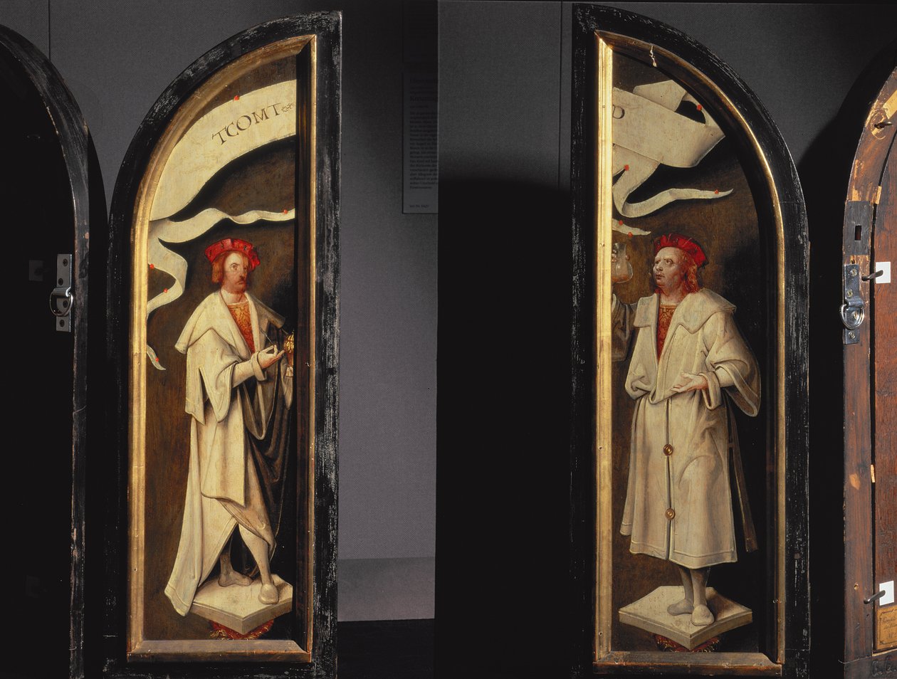 The Cleansing of Naaman Triptych: sidopaneler föreställande martyrerna Cosmas och Damian, beskyddare mot sjukdom, 1520 (panel) av Cornelis Engebrechtsz