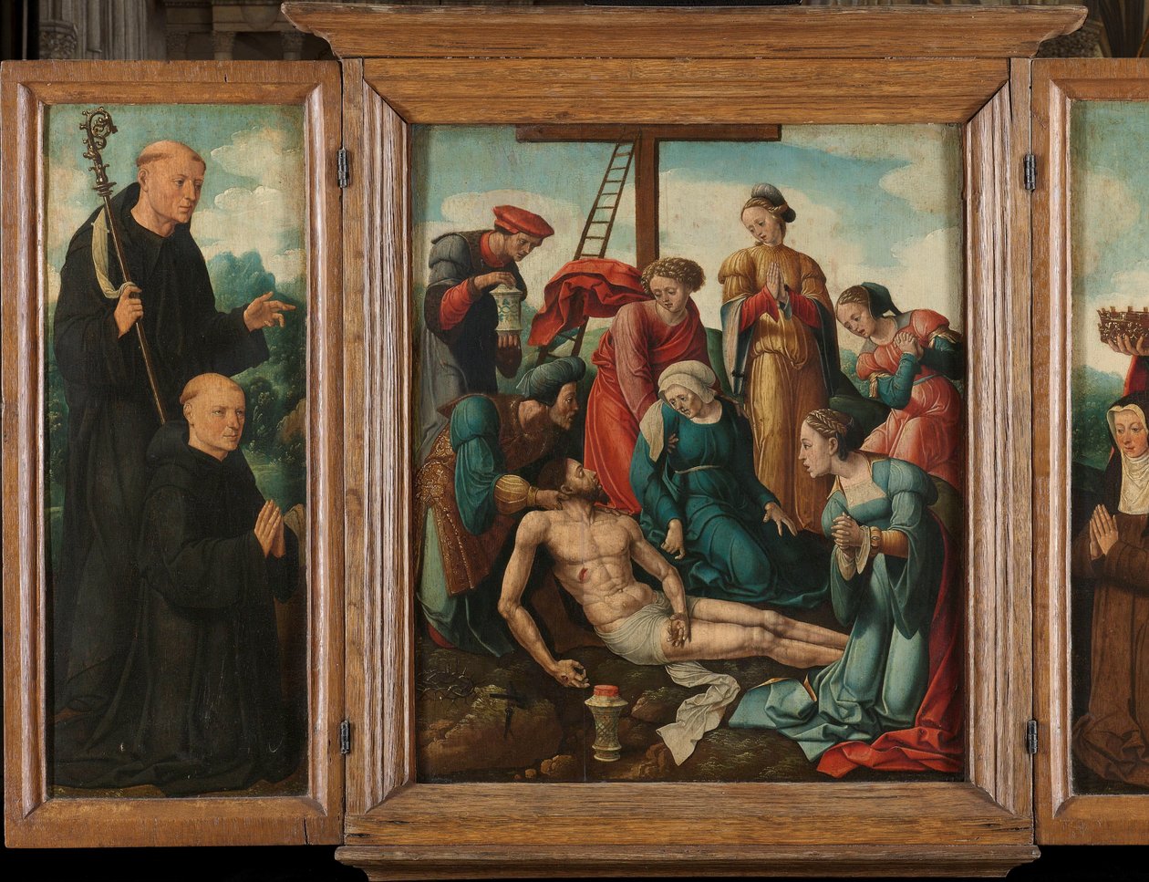 Triptyk med Kristi klagan (mitten), flankerad av den manliga donatorn med Sankt Benedictus (vänster, inre flygeln) och kvinnlig donator med Sankta Elizabeth av Thüringen (höger, innervingen) av Cornelis Cornelisz II Buys (attributed to)