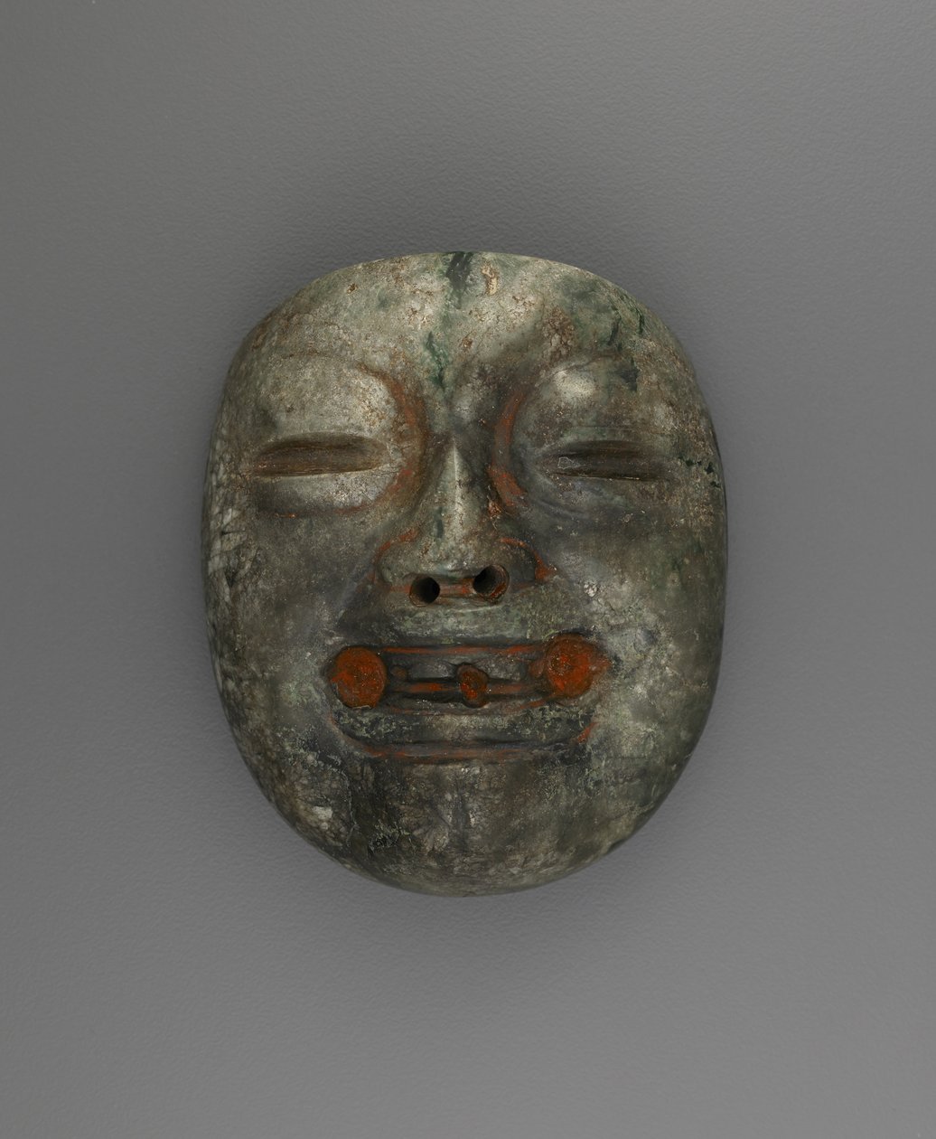 Hänge i form av en mask av Culture Olmec
