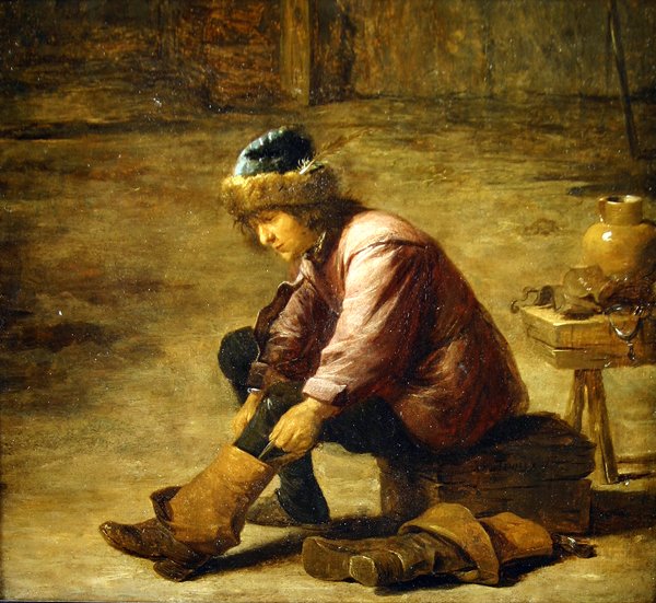 En ung man drar på sig en känga av David Teniers the Younger