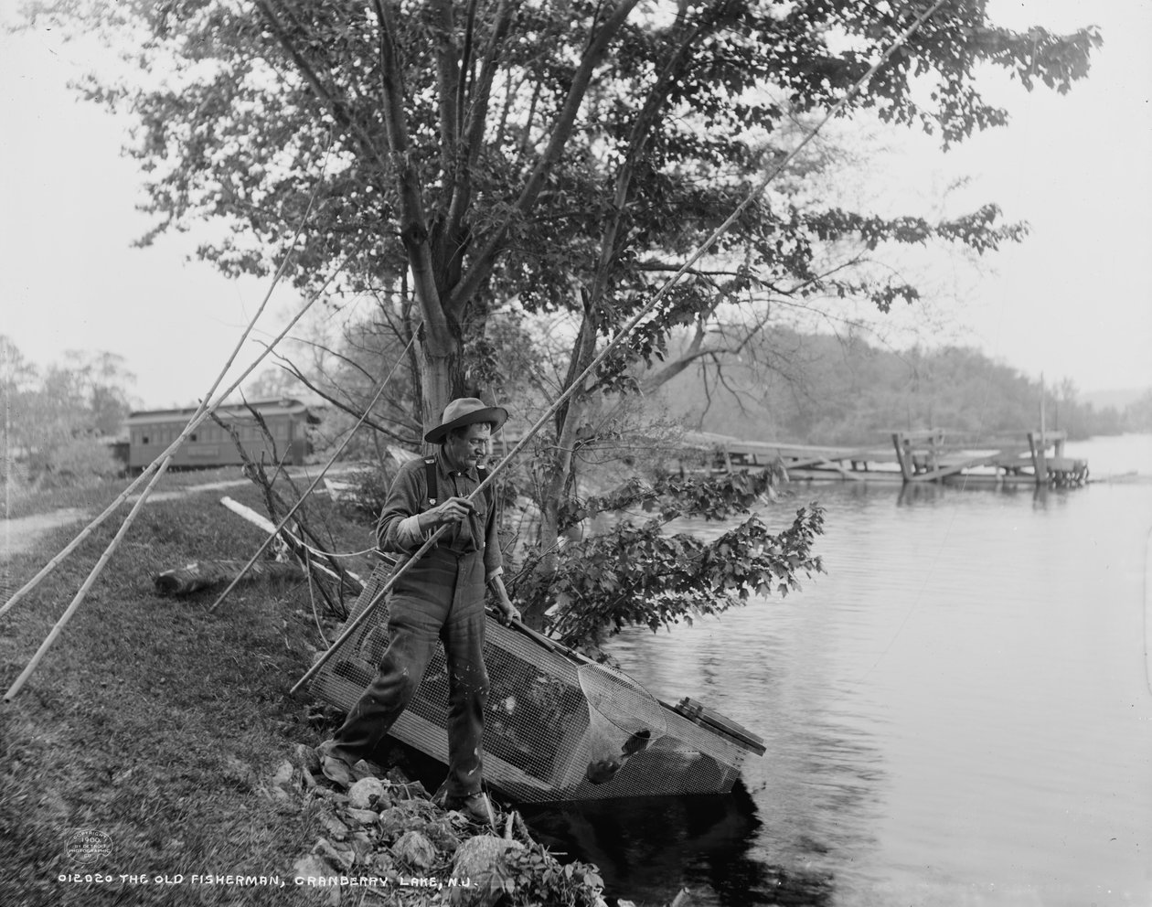Den gamle fiskaren, Cranberry Lake, N.J., ca 1900 av Detroit Publishing Co.