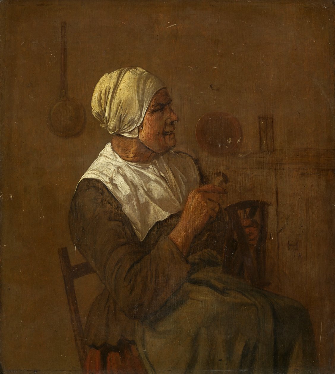 En gammal kvinna sittande, ca 1650-1700 (olja på panel) av Dutch School