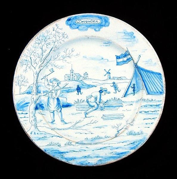 Delftware-tallrik föreställande december månad (tennglaserat lergods) av Dutch School