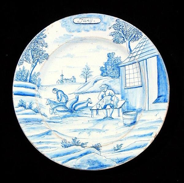 Tallrik från Delftware med juni månad (tennglaserat lergods) av Dutch School