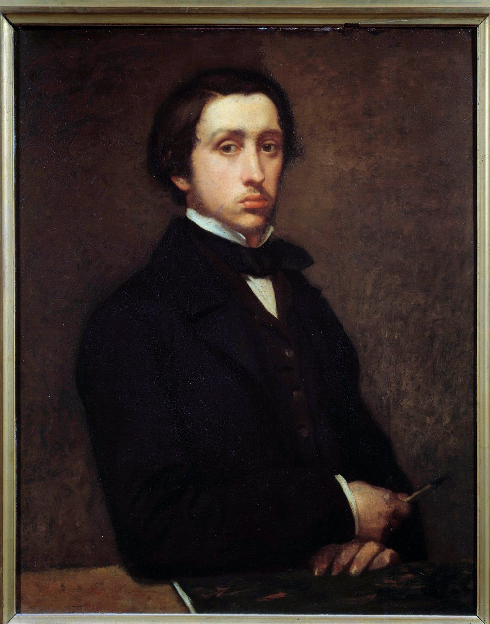 Självporträtt eller Degas i porträttmålning av Edgar Degas (1834-1917) 1855 Sön. 0,81x0,64 m Paris, musee d