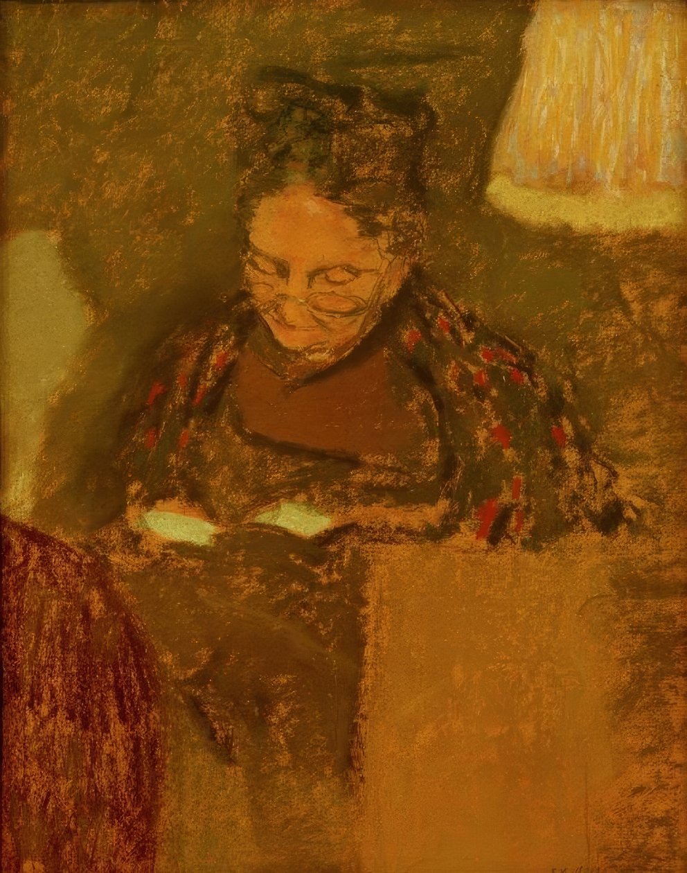 Madame Vuillard läser i ljuset från en lampa av Edouard Vuillard