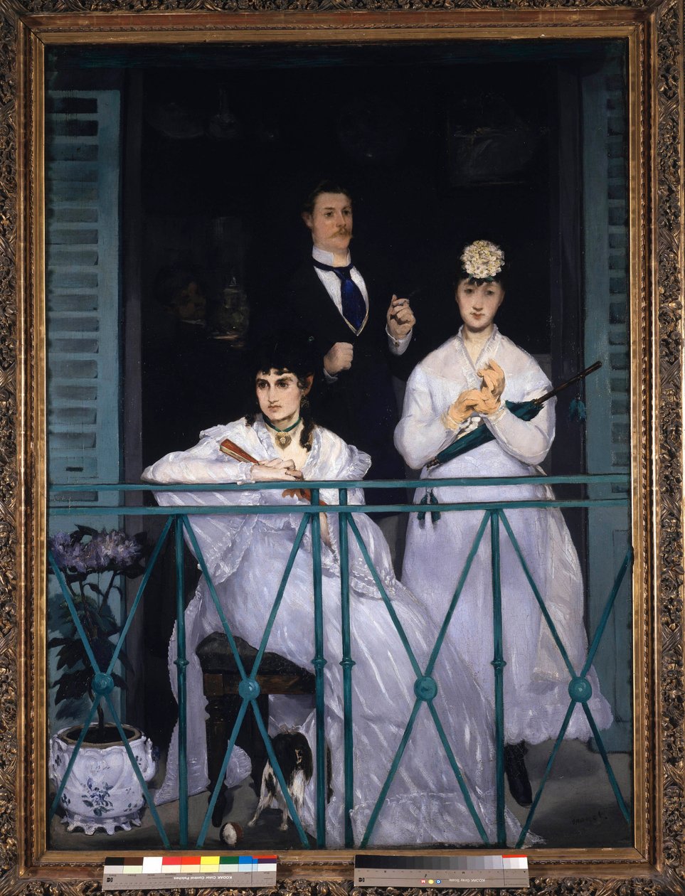 Balkong Två unga kvinnor som håller en fläkt och ett paraply och en man med en slips. Porträtt av Berthe Morisot (1841-1895), fransk målare, Fanny Claus (1846-1877), violinist, Antoine Guillemet (1841-1918) landskapsarkitekt och bakgrund Leon Leenhoff. Mål av Édouard Manet