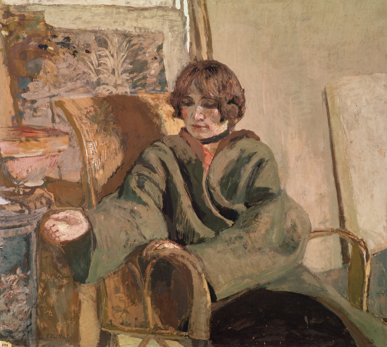 Kvinna som sitter bredvid en spis av Edouard Vuillard