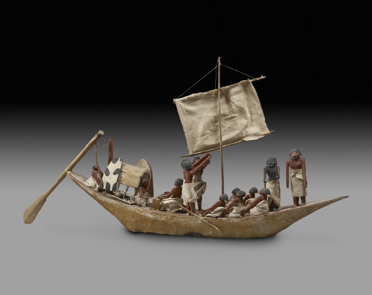Modell krigsbåt med segel, åror och 14 figurer, 9:e-11:e dynastin (ca 2125-1940) (trä, gesso, textil, färg, linne och snöre) av Egyptian