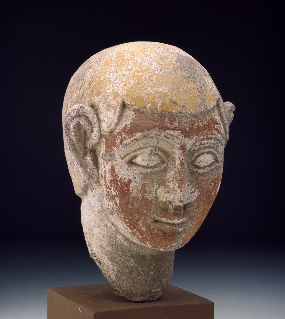 Målat sandstenshuvud av en ba-staty, ca 1-300 (huggen grå sandsten målad i rött och gult) av Egyptian