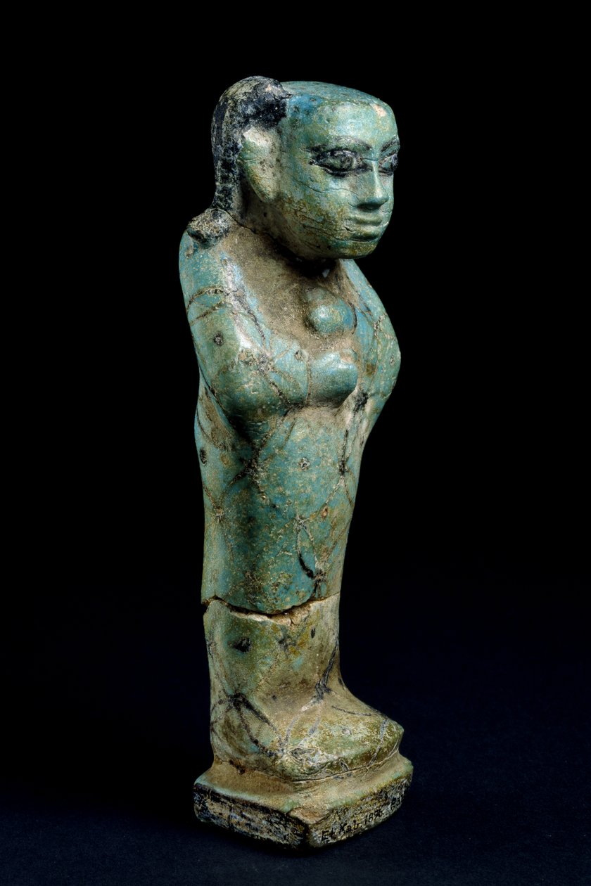 Statyett av ett barn i en höljefajans av Egyptian 12th Dynasty