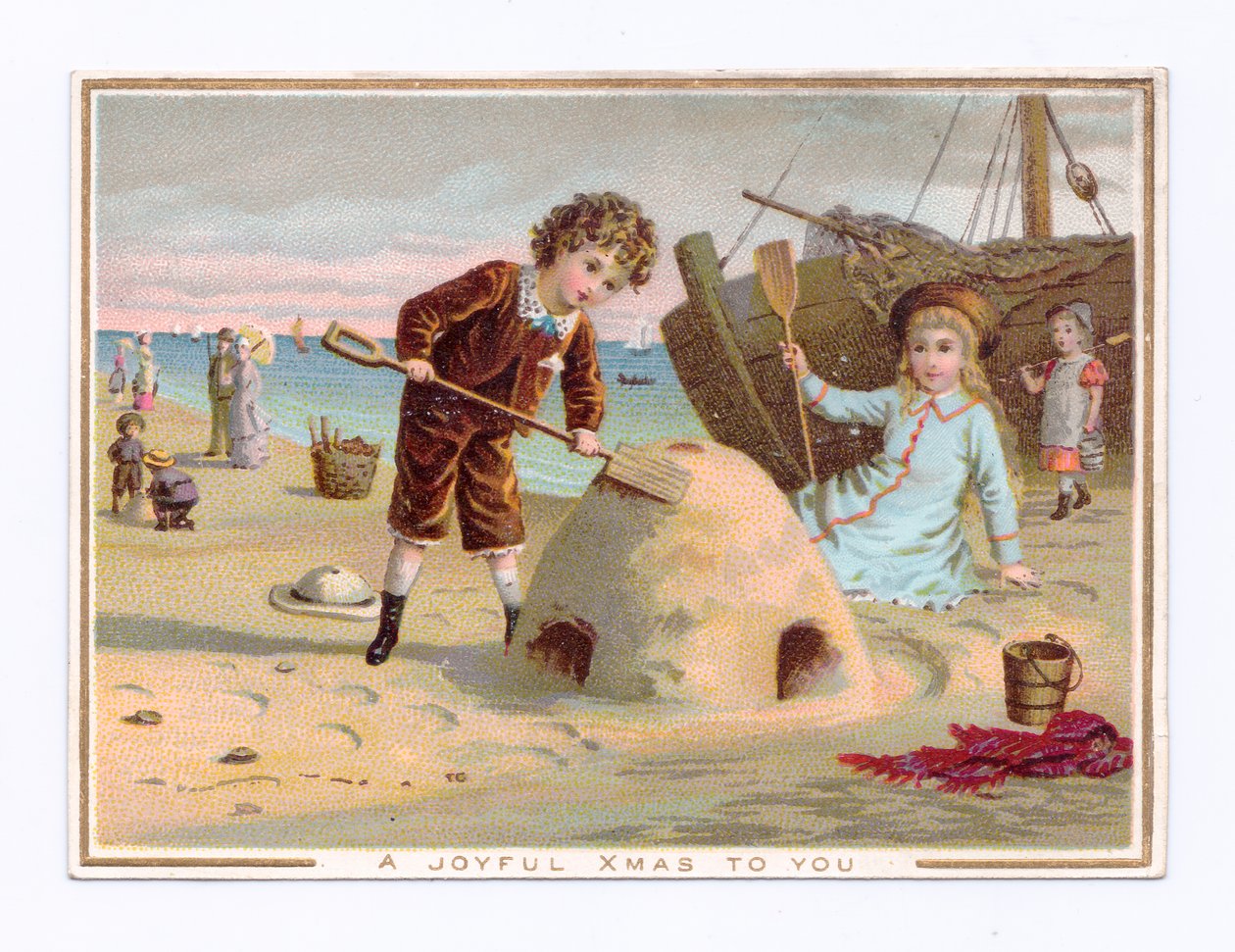 Ett viktorianskt julkort av en pojke som bygger ett sandslott på en strand, ca 1880 (färg litho) av English School