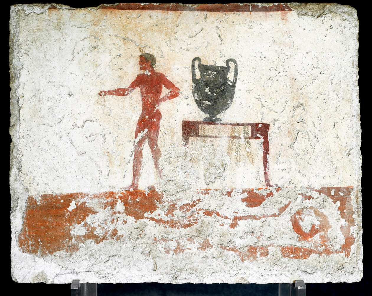 Etruskisk konst: en ung naken ephebe nära ett bord där en vas är placerad. Fresk av "dykarens grav". Från Paestums södra kyrkogård. 480-470 f.Kr. Museo Archeologico Nazionale, Paestum av Etruscan