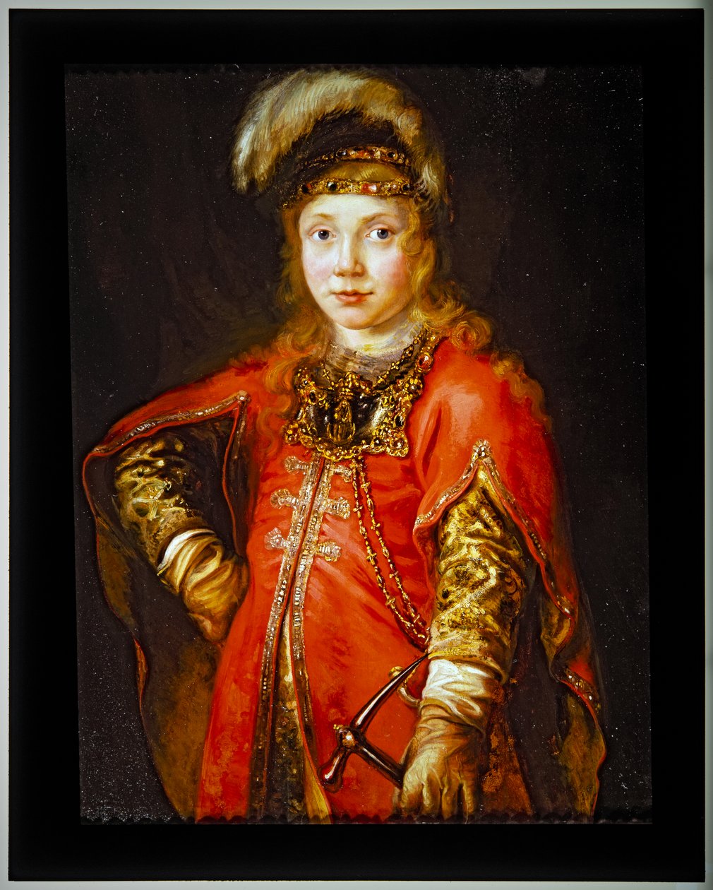 Porträtt av en yngling i röd tunika av Ferdinand Bol