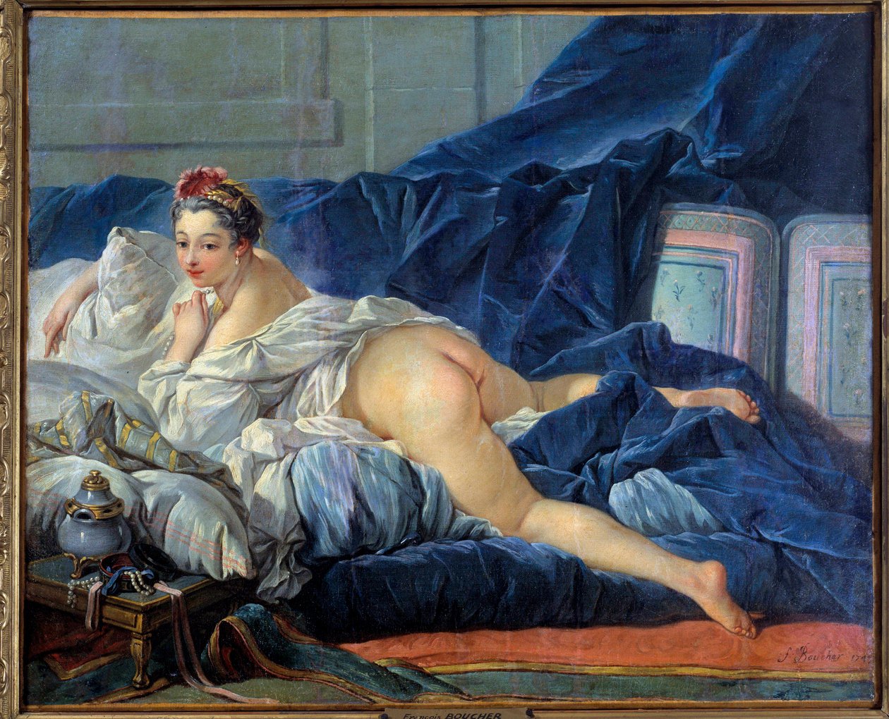 Den odalistiska unga kvinnan sitter på en soffa. Målning av Francois Boucher (1703-1770) 1752 Reims musee des Beaux Arts av François Boucher