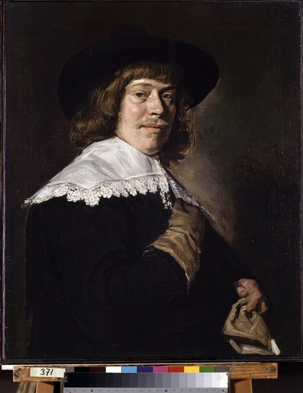 Porträtt av en man som håller en handske. Porträtt av en ung man som håller en handske. Målning av Frans Hans Hals I (1581-1666), ca 1650. Olja på duk. Holländsk konst, barockstil. Eremitagemuseet, Sankt Petersburg. av Frans Hals
