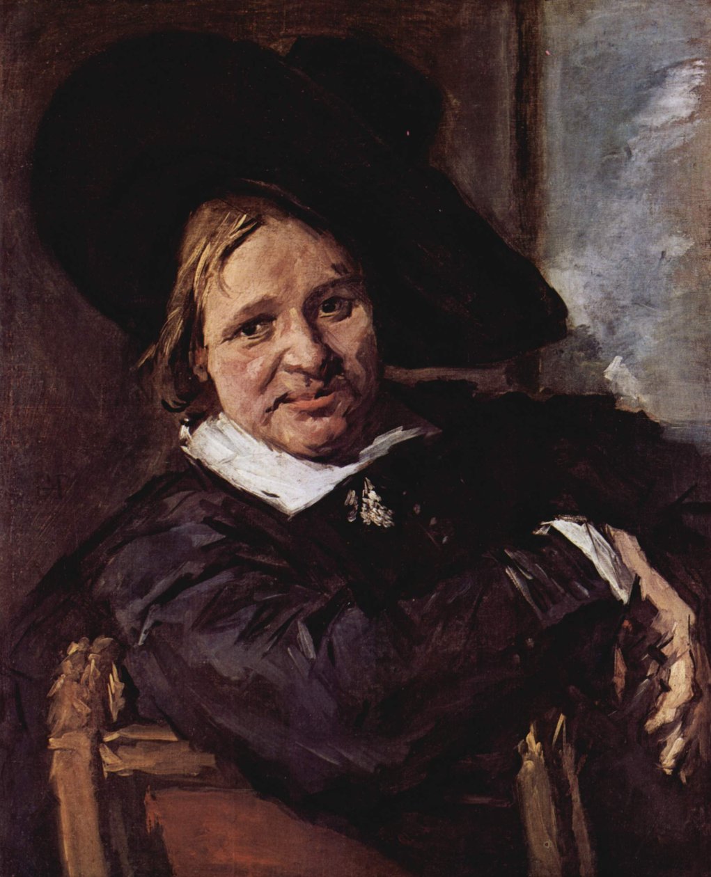 Porträtt av en man som sitter och bär en mjuk hatt av Frans Hals