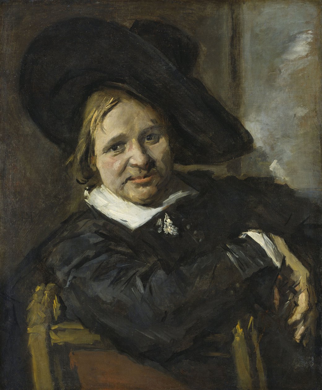 Porträtt av en man som sitter och bär en mjuk hatt av Frans Hals