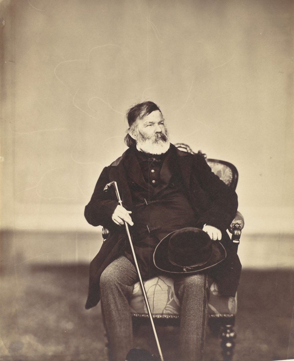 [Sittande man med käpp och hatt], 1850-60-tal. av Franz Antoine