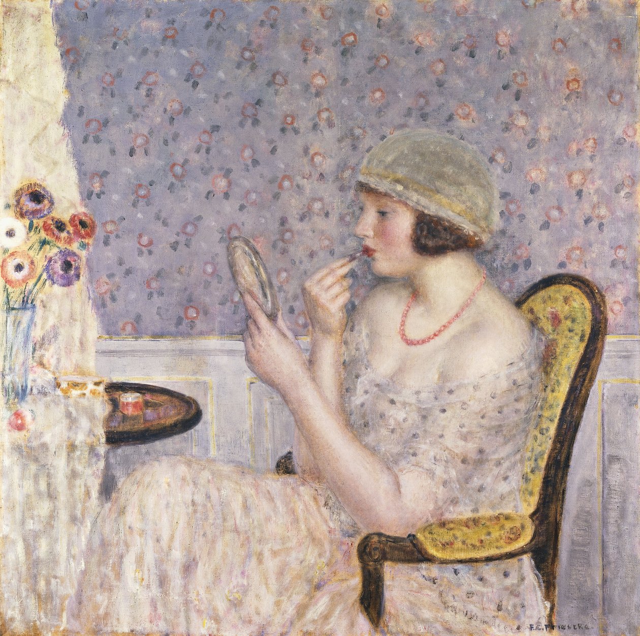 Kvinna vid ett toalettbord av Frederick Carl Frieseke