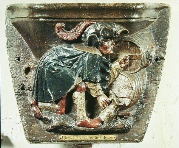 Misericord från en körstall föreställande en man som testar vin, från kyrkan Saint-Etienne des Tonneliers, Rouen (polykromt trä) av French School