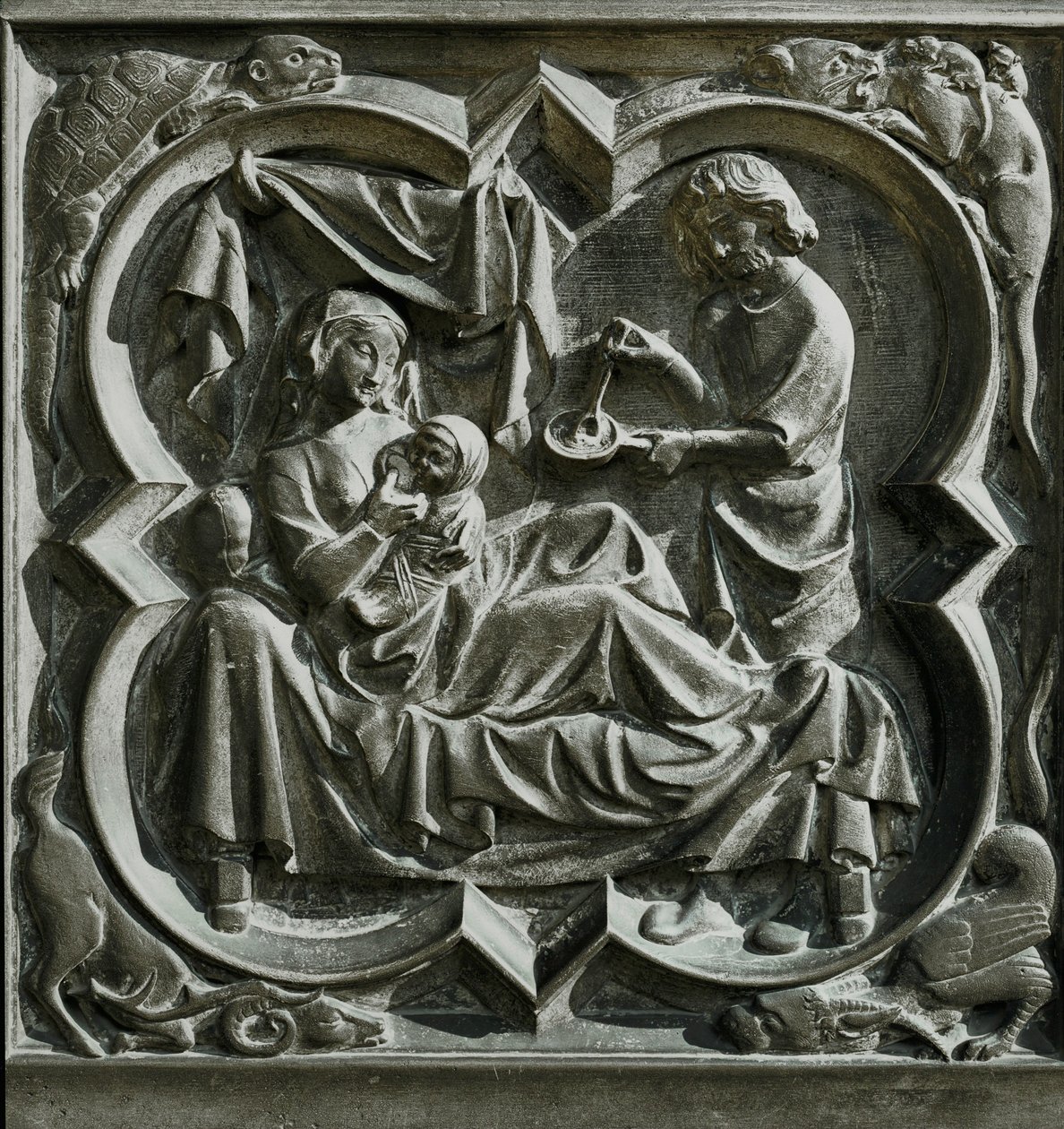 Adam lagar mat medan Eva, i sängen, tar hand om ett barn ... (relief) av French School