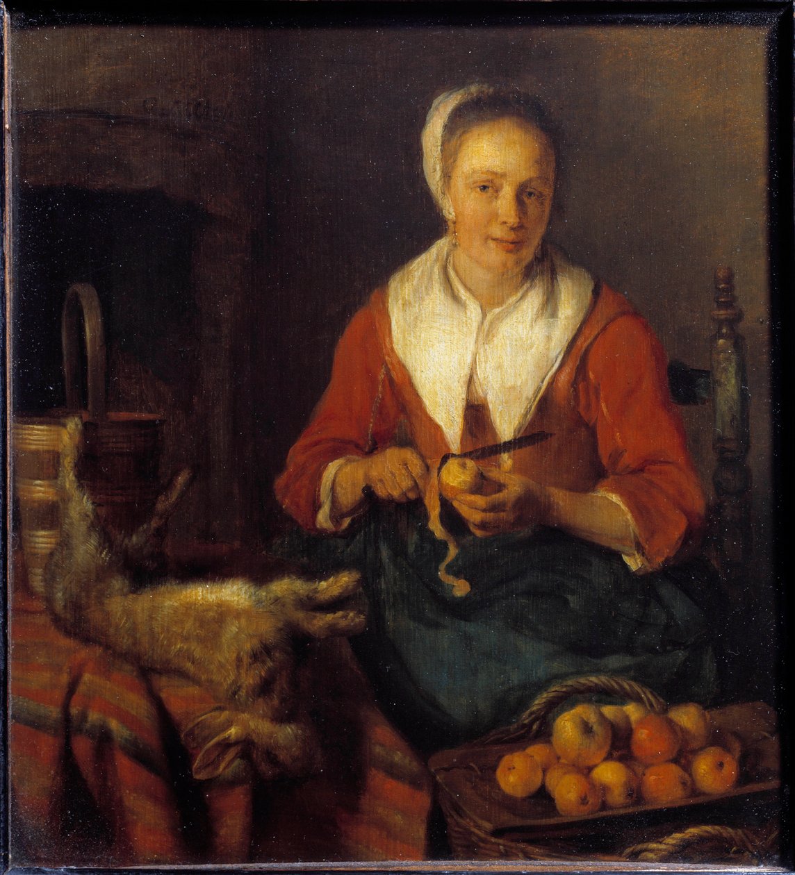 Äppelskalet. En kvinna skalar äpplen för att laga mat med en kanin. Målning av Gabriel Metsu (1629-1667) Ec. Hol. av Gabriel Metsu