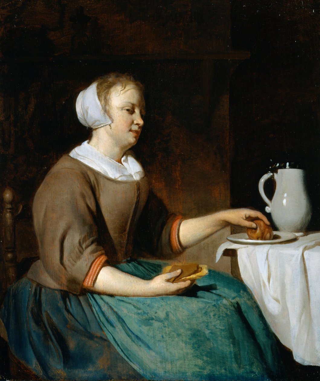 Ung kvinna äter vid ett bord av Gabriel Metsu