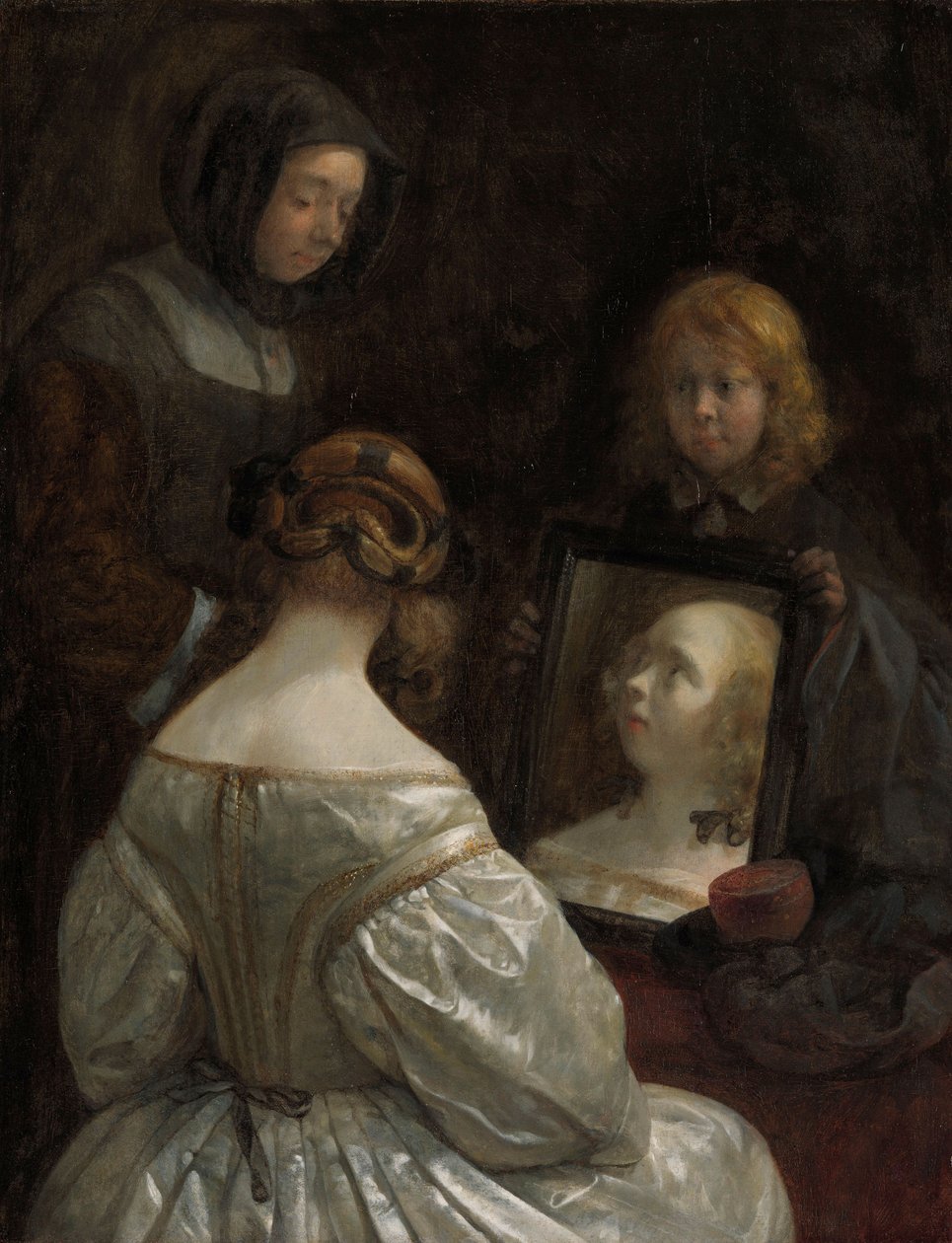 Kvinna vid en spegel, ca. 1652 av Gerard ter Borch