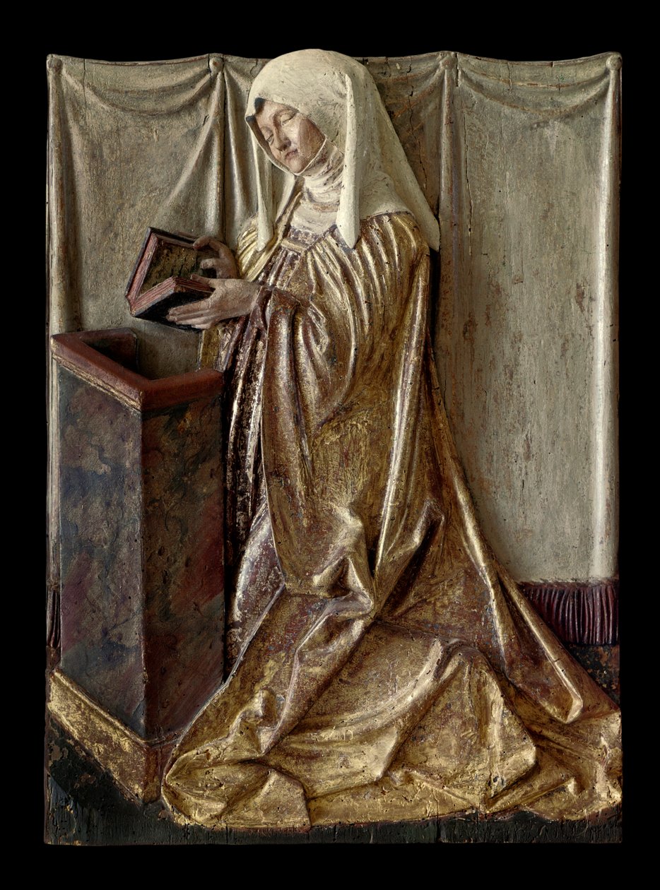 Knästående donator Fragment av en snidad altartavla i polykromt trä. Från Schwaben. 1520 ca. Paris, Louvren av German School