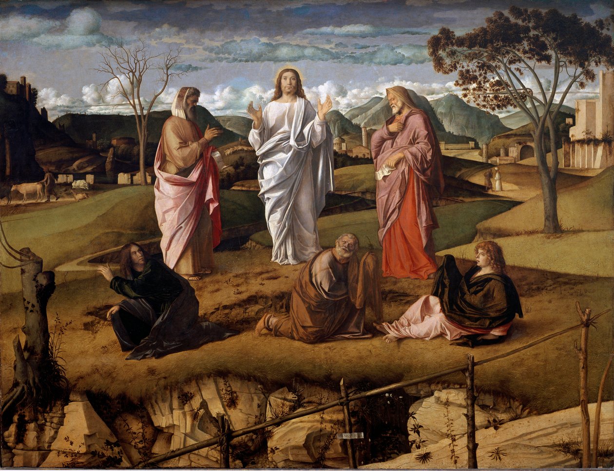 Kristi förvandling. Gamla testamentets karaktärer Moses och Elia representeras runt Jesus. Konstnärens signatur är representerad på ett papper som håller stängningen i förgrunden. Målning av Giovanni Bellini sa il Giambellino (1432 av Giovanni Bellini