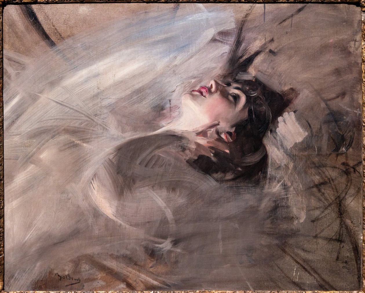Halva längden av ung kvinna som ligger ner av Giovanni Boldini
