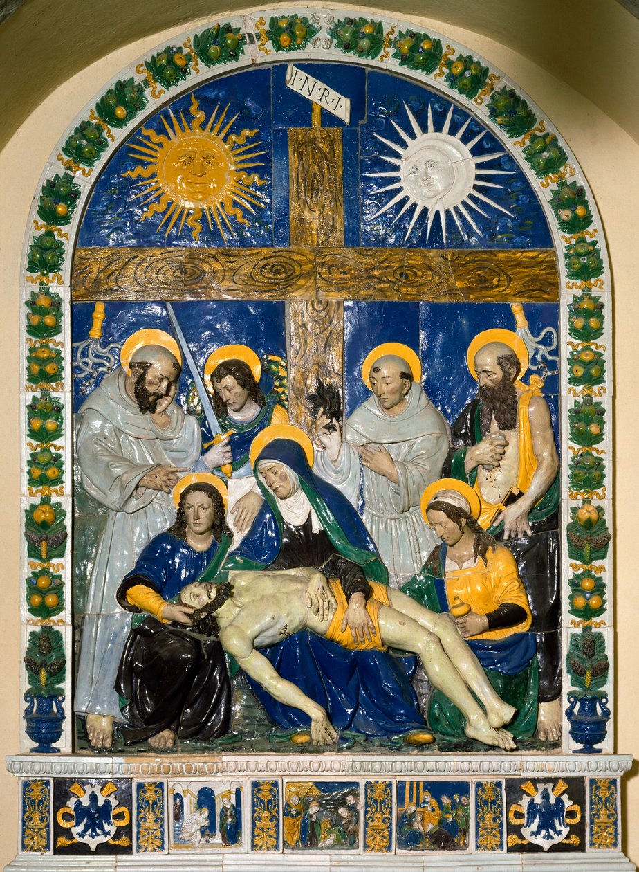 The Deposition (Pieta)” Jesus Kristus och Jungfru Maria omgiven av Sankt Johannes och Sankta Maria Magdalena före korset med inskriptionen INRI (I.N.R.I.) Högreliefkeramik av Giovanni della Robbia (1469-1529) 1525 Dim. 287x210 cm Santuario della V av Giovanni della Robbia