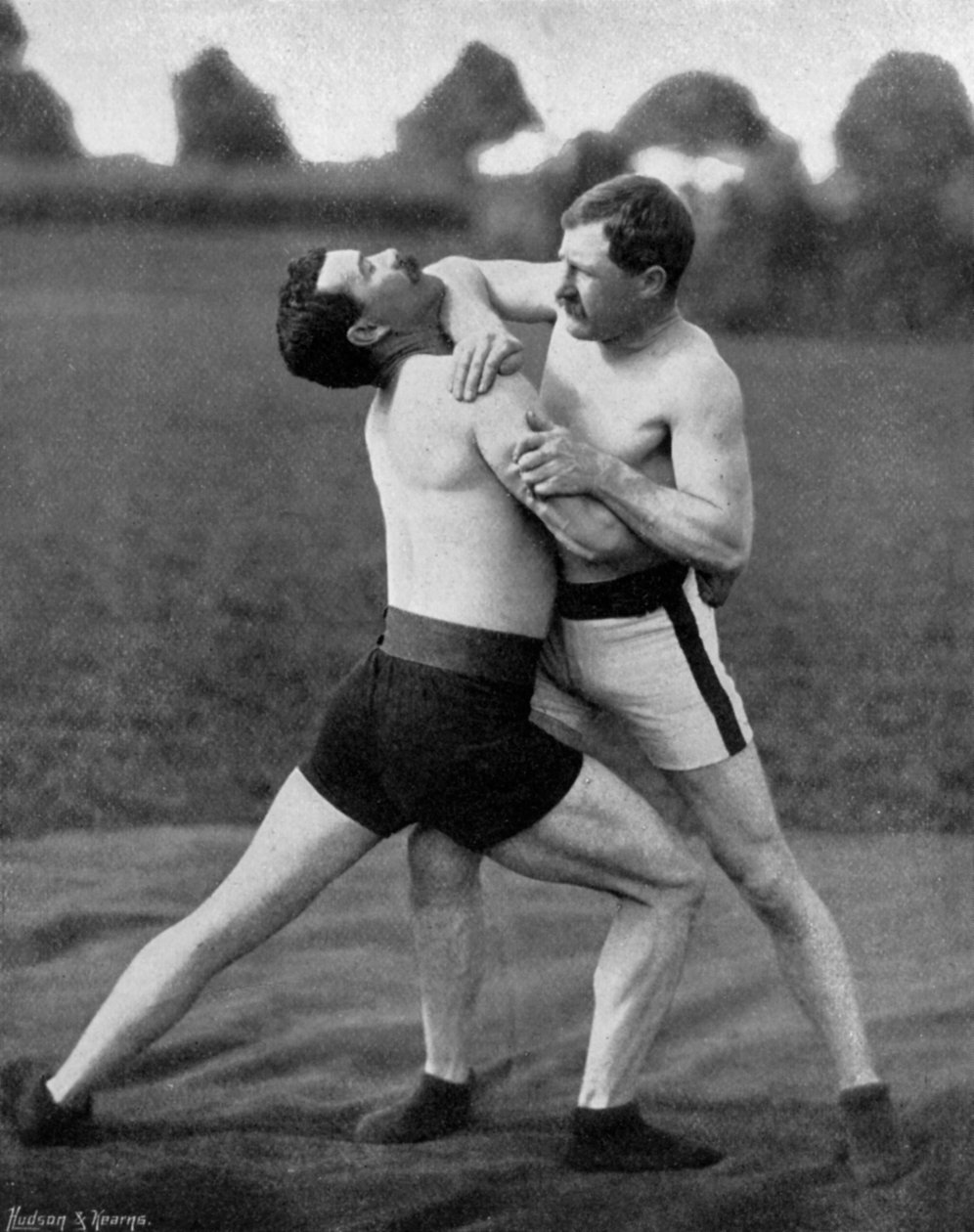 The body holt and neck double, wrestling display, Aldershot, Hampshire, 1896 av Gregory and Co