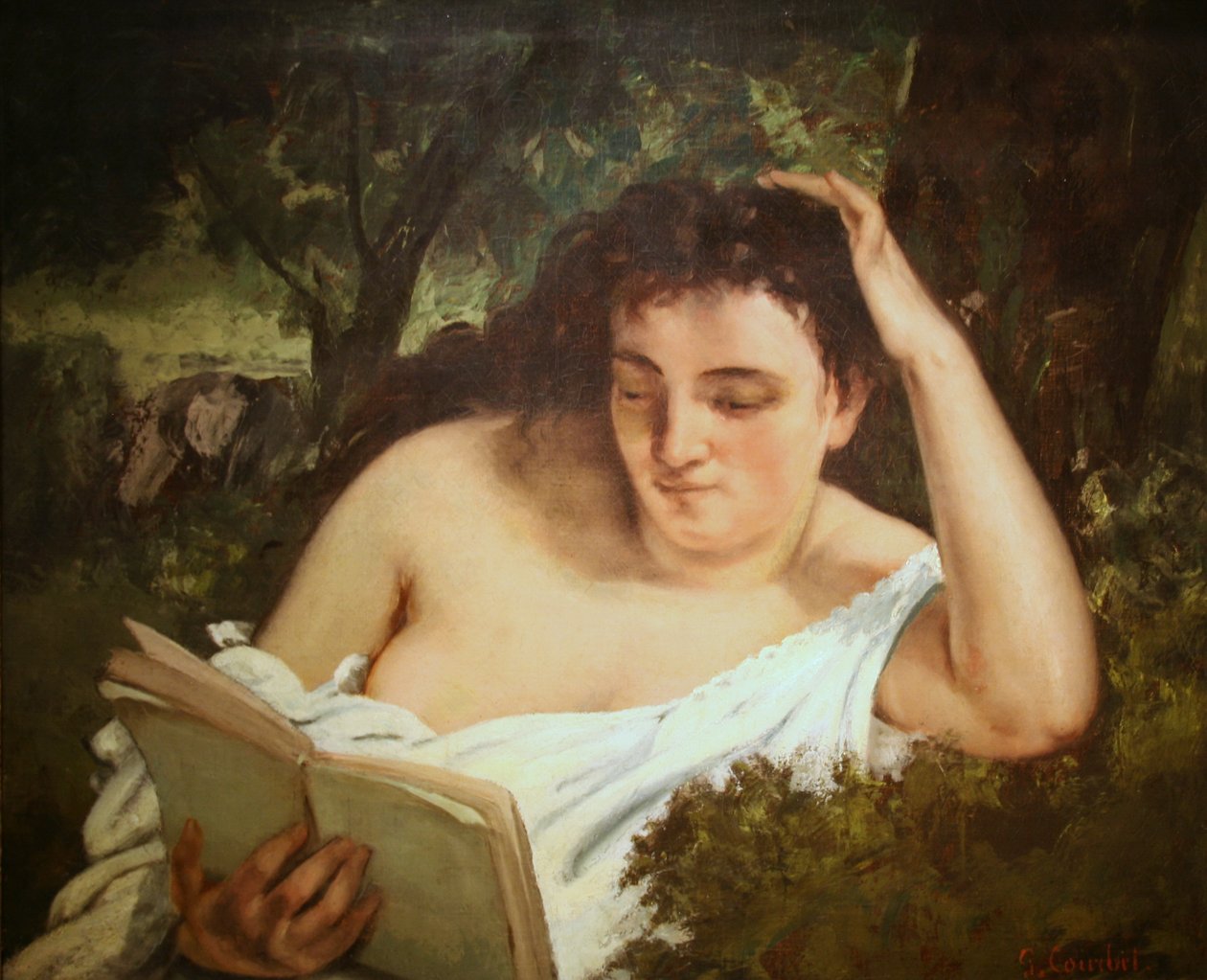 A Young Woman Reading av Gustave Courbet
