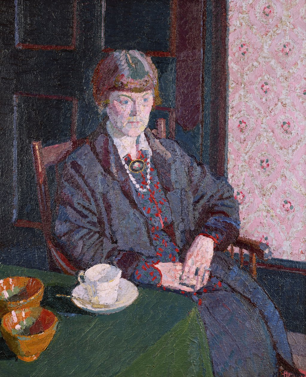 Kvinna som sitter vid ett bord av Harold Gilman